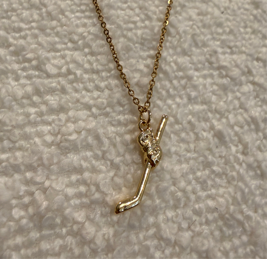 Gold hockey necklace