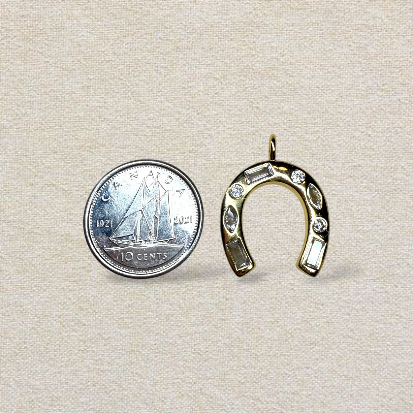 gold and glitzy horseshoe charm