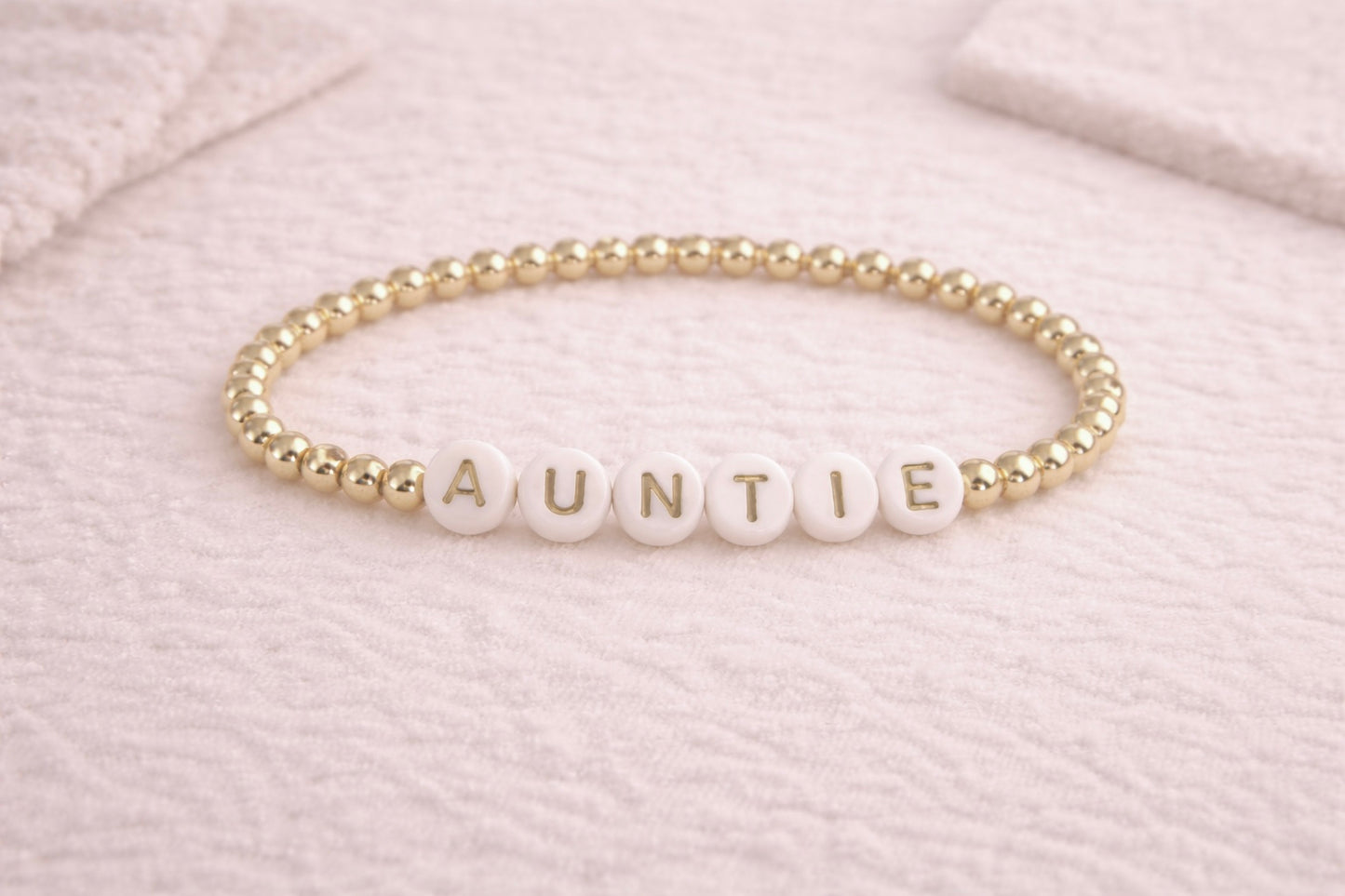 the auntie bracelet in gold