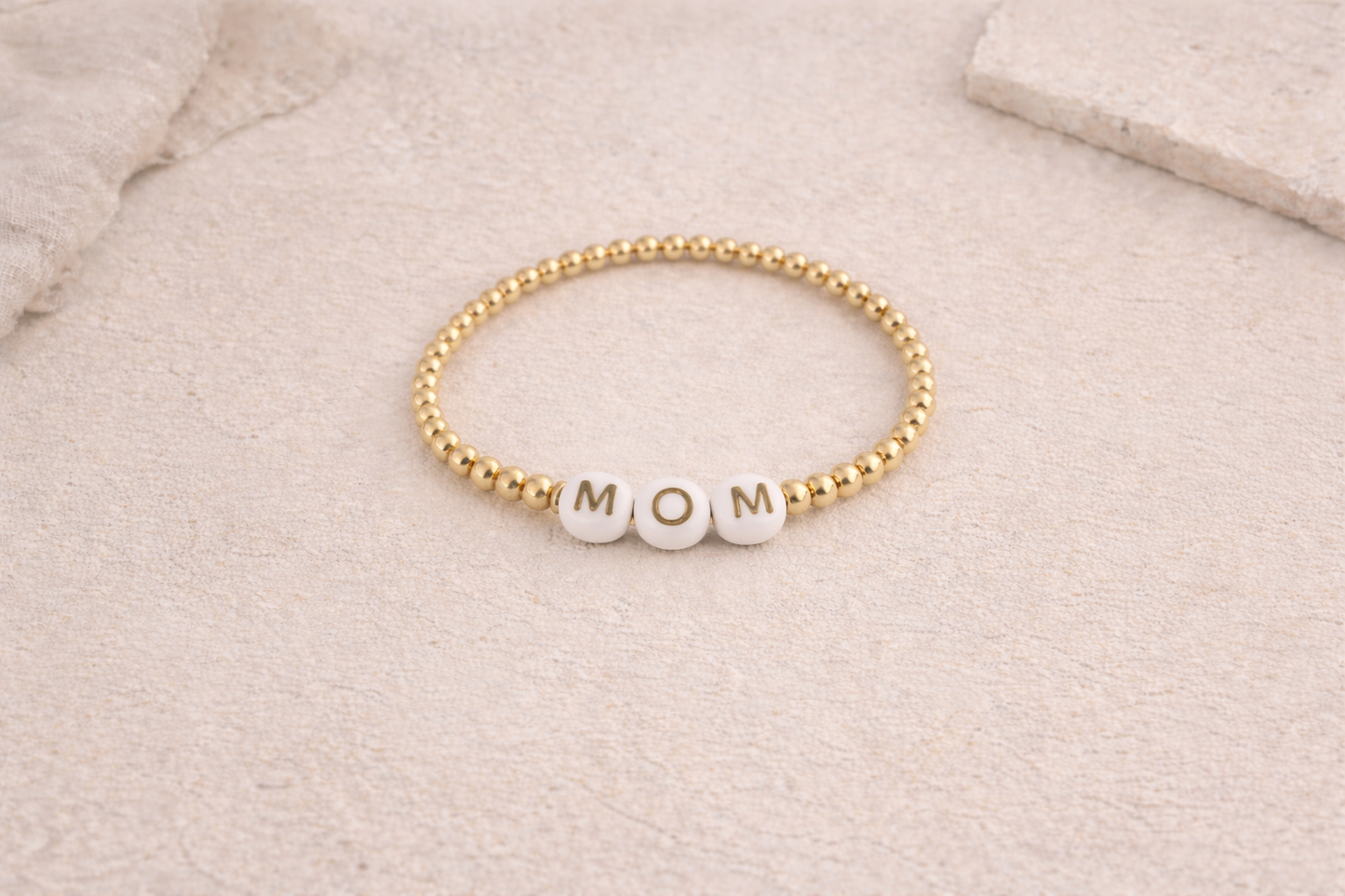 the mom bracelet in gold