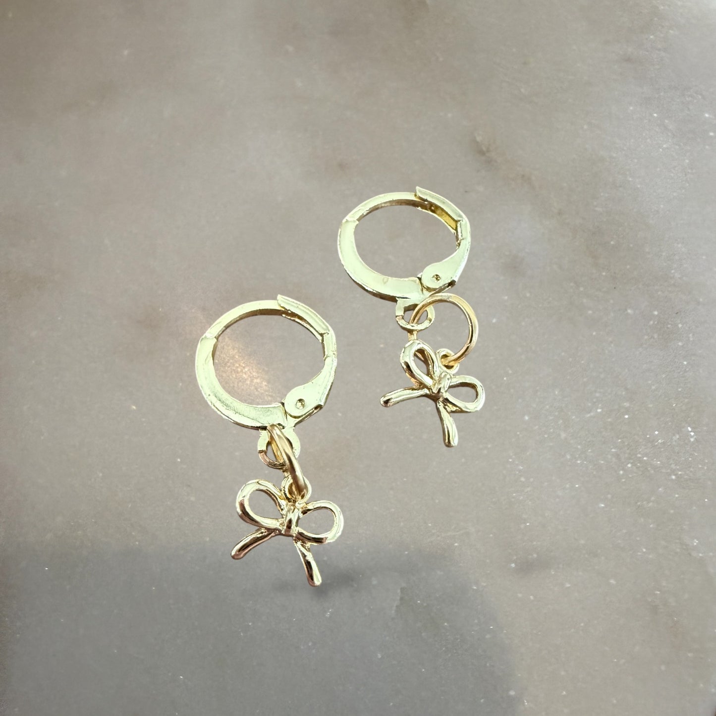 Bow huggie earrings