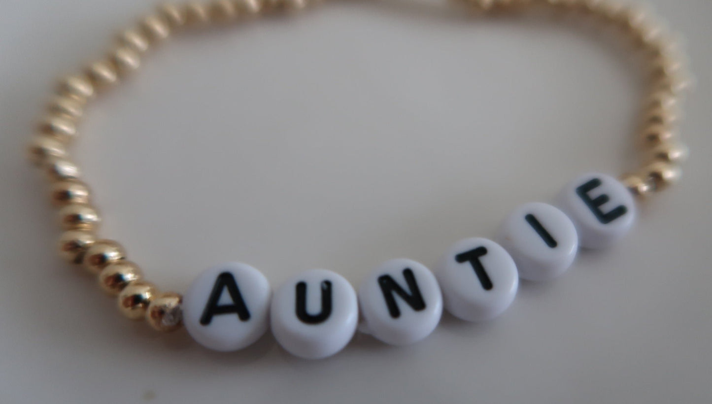 the auntie bracelet in gold