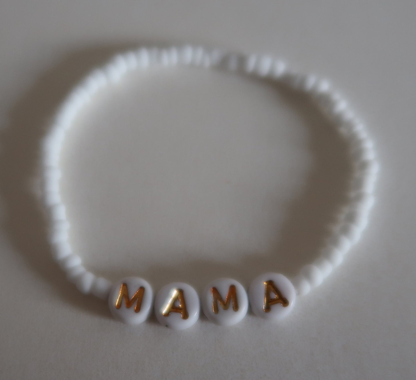 the mama bracelet in white and gold