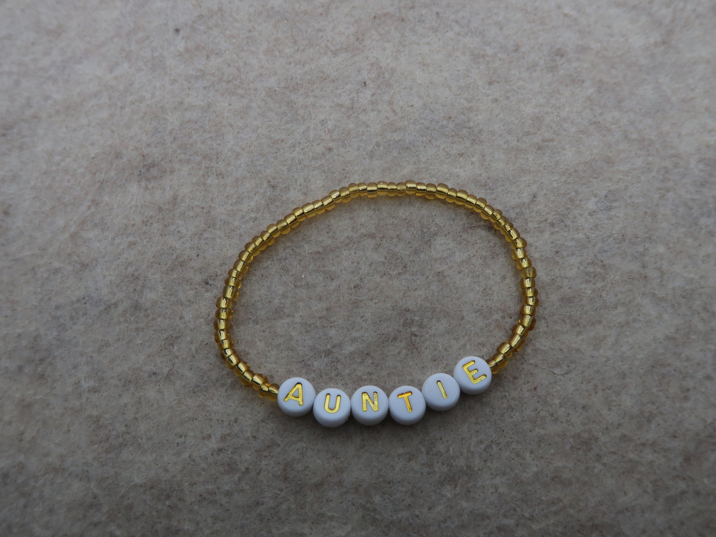 the auntie bracelet in gold
