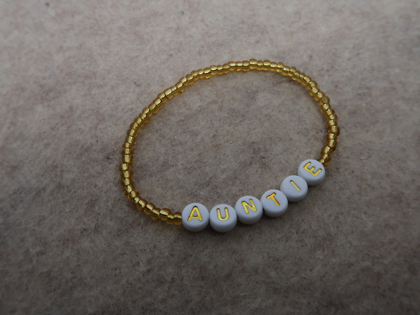 the auntie bracelet in gold