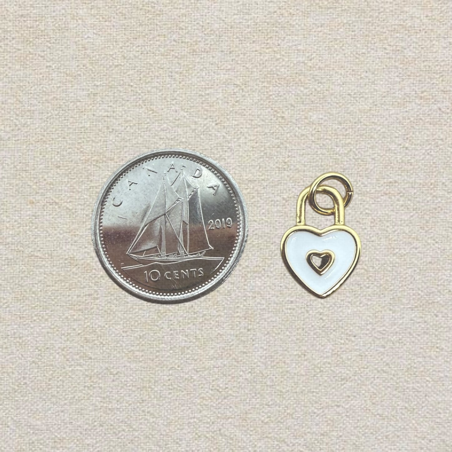 gold and white heart charm