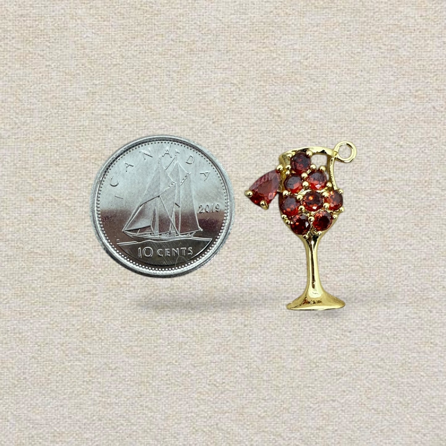 gold and red cocktail charm