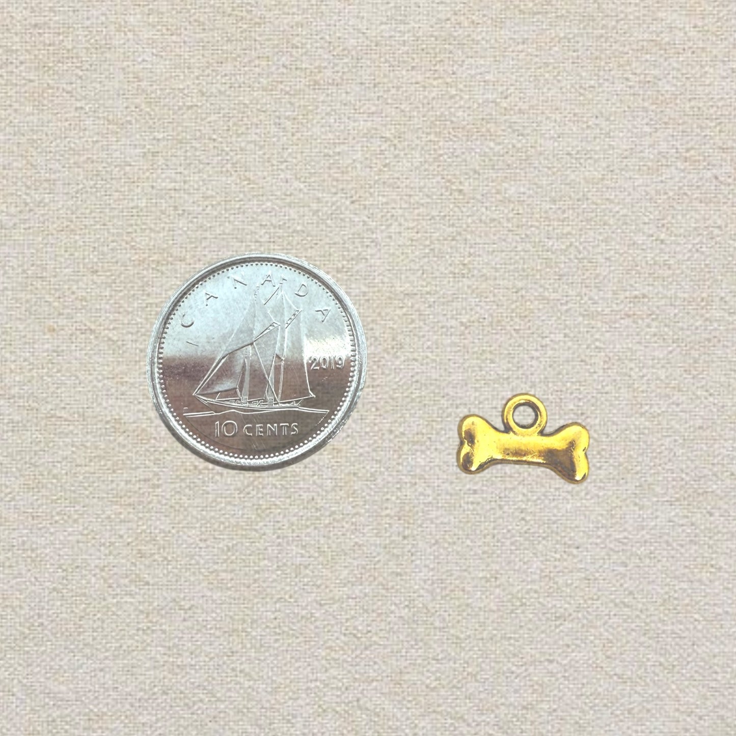 gold dog bone charm (2)