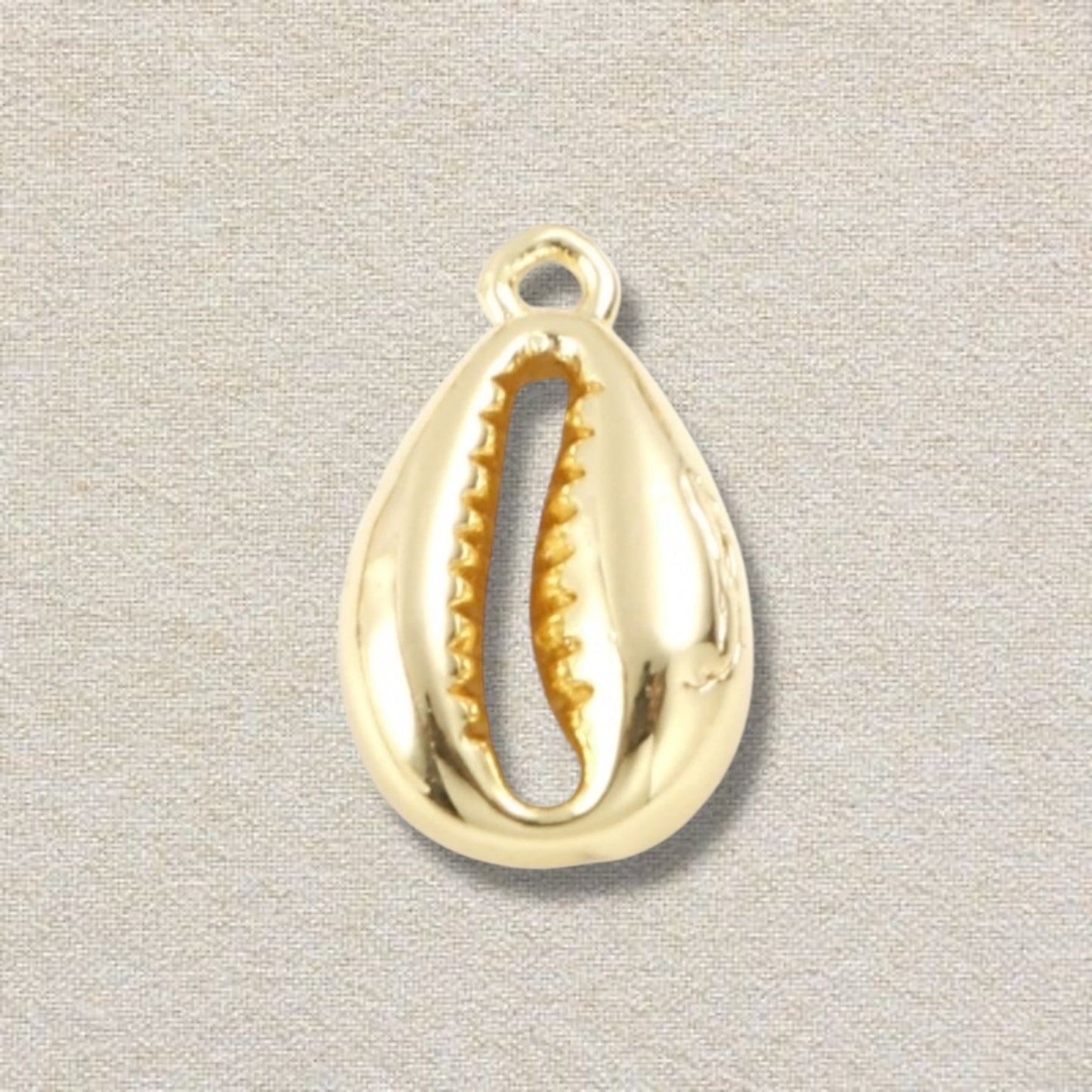 gold cowrie shell charm