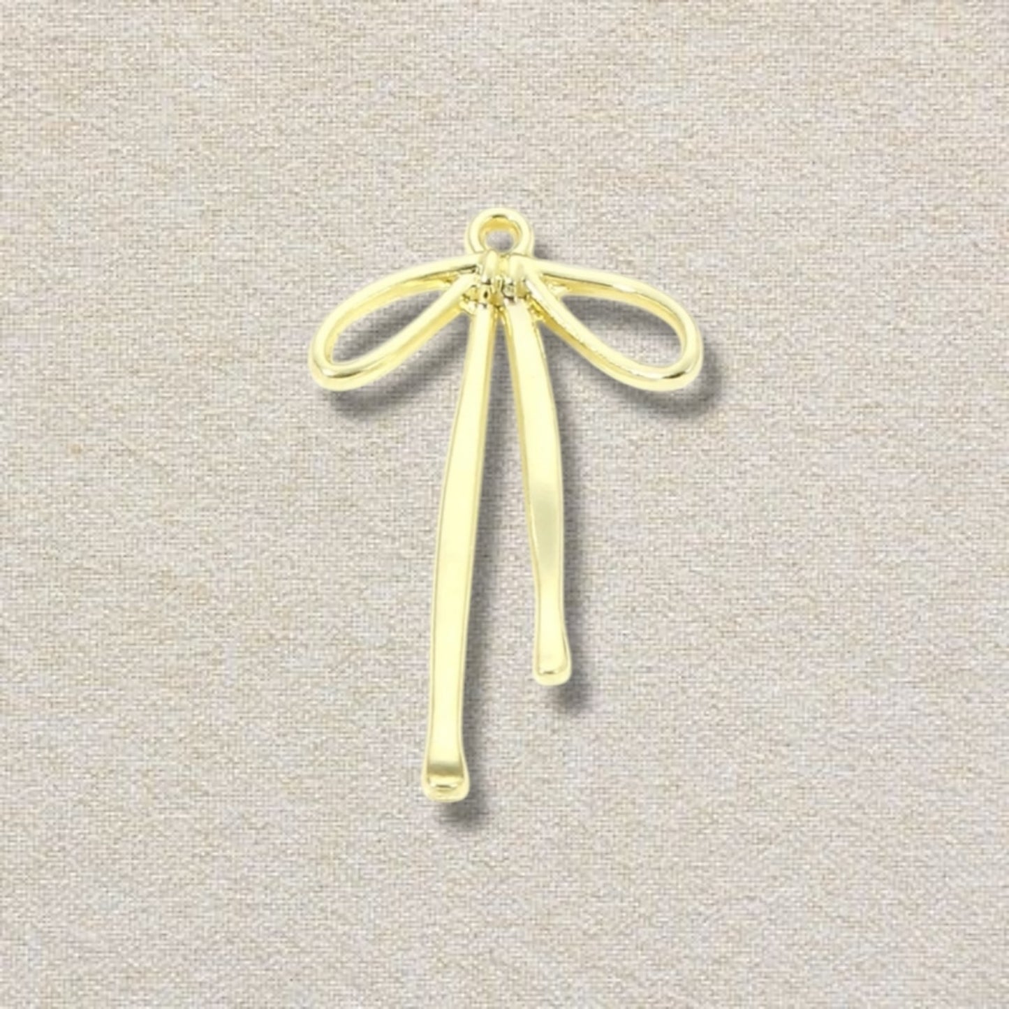 gold bow (long string) charm