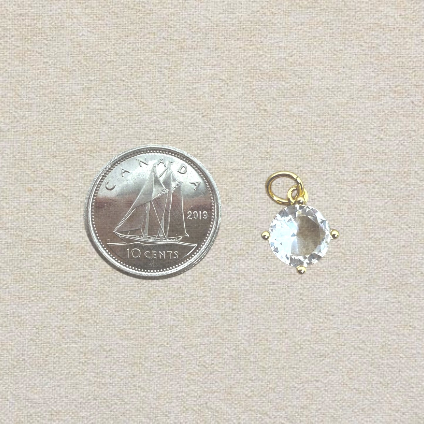 gold round cubic zirconia charm