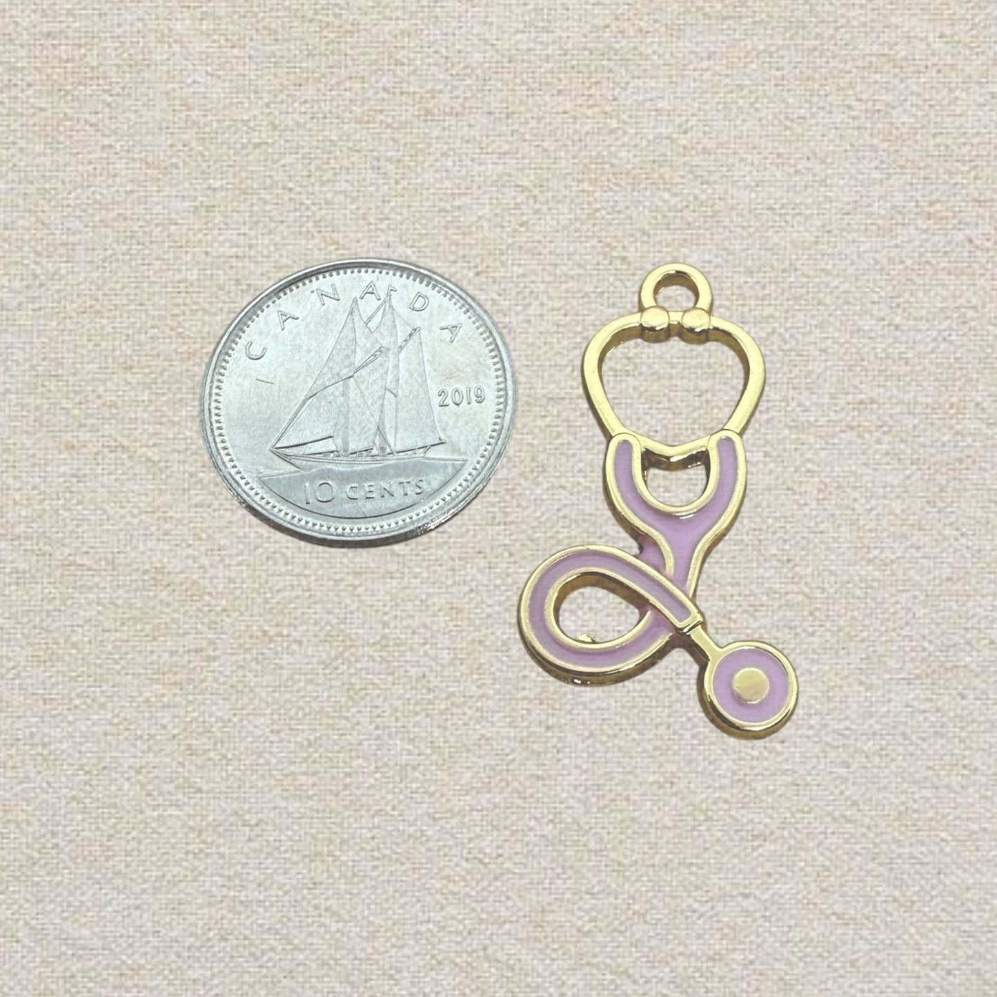 pink and gold stethoscope charm
