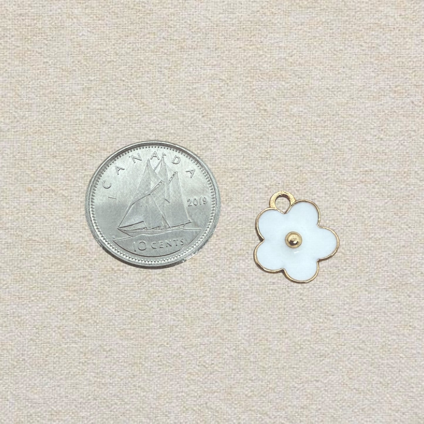 white flower enamel charm