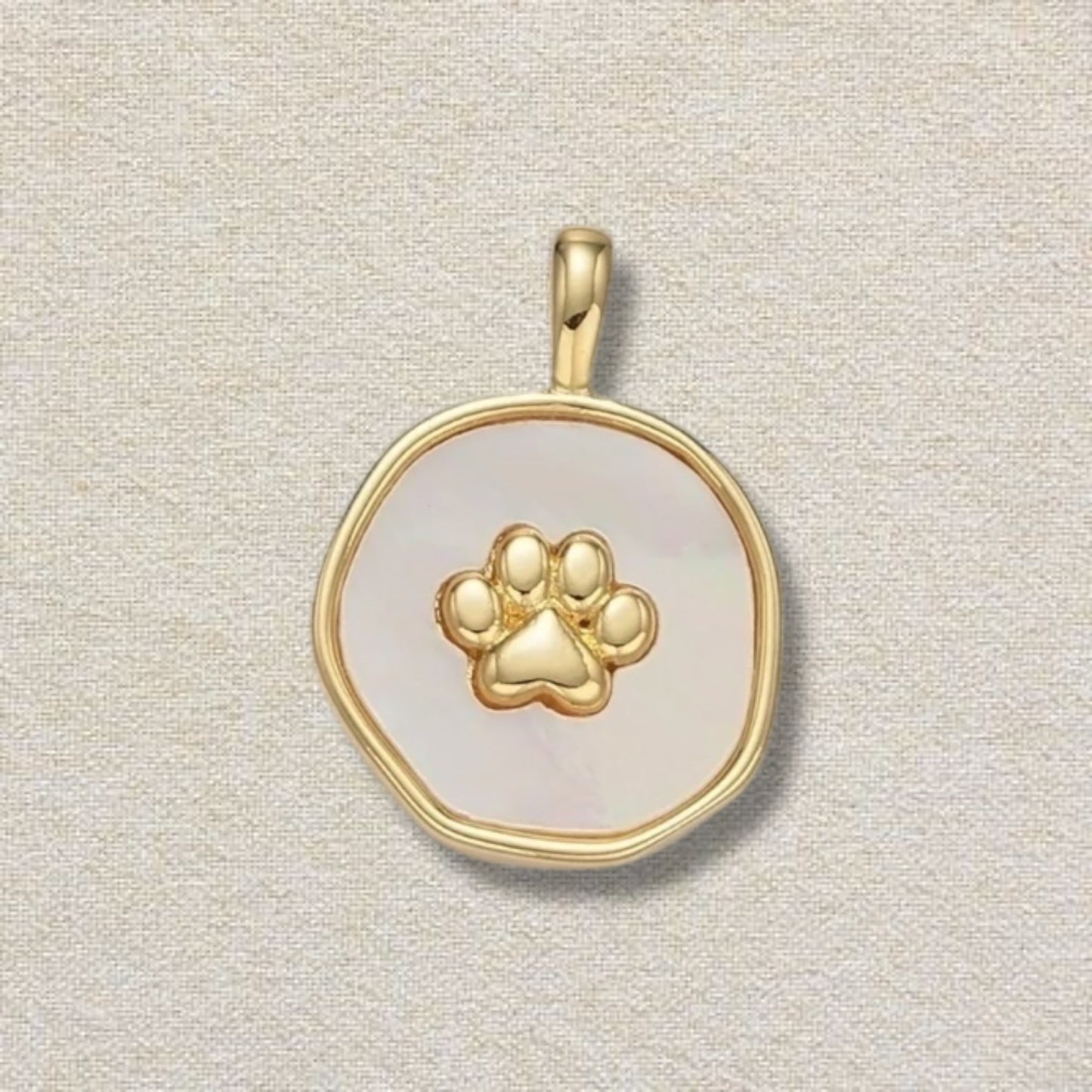gold and white paw pendant