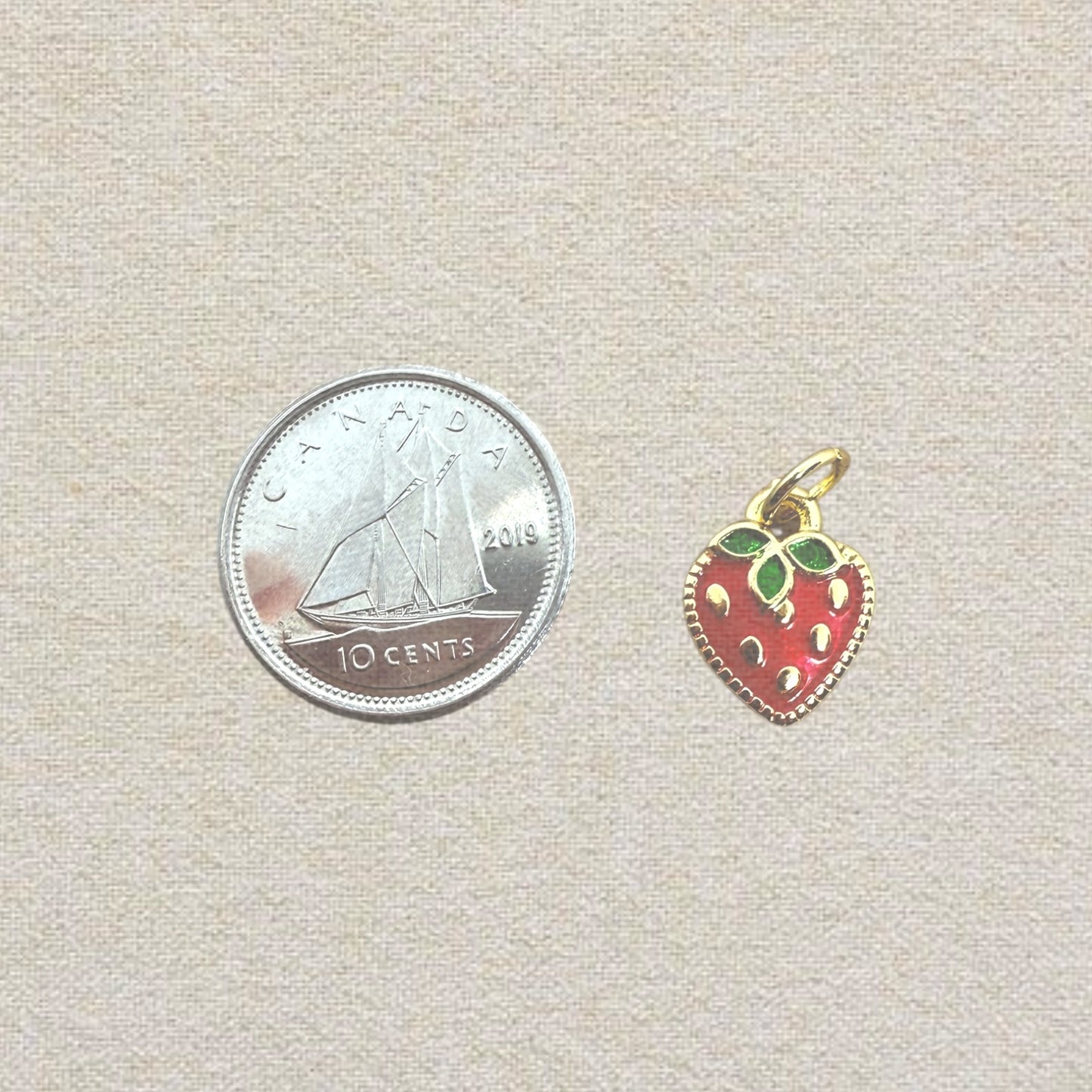 gold and red strawberry charm