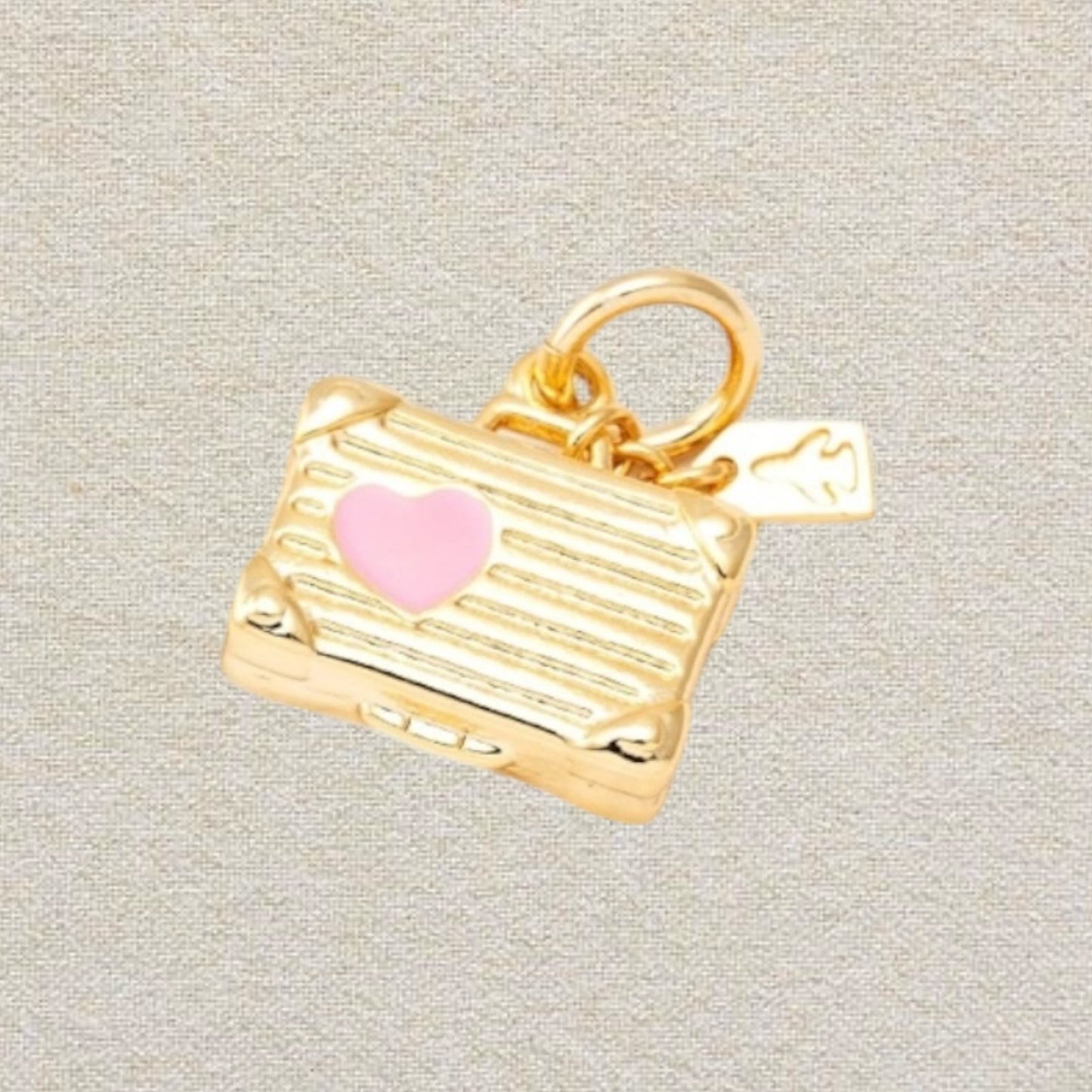 gold and pink suitcase charm