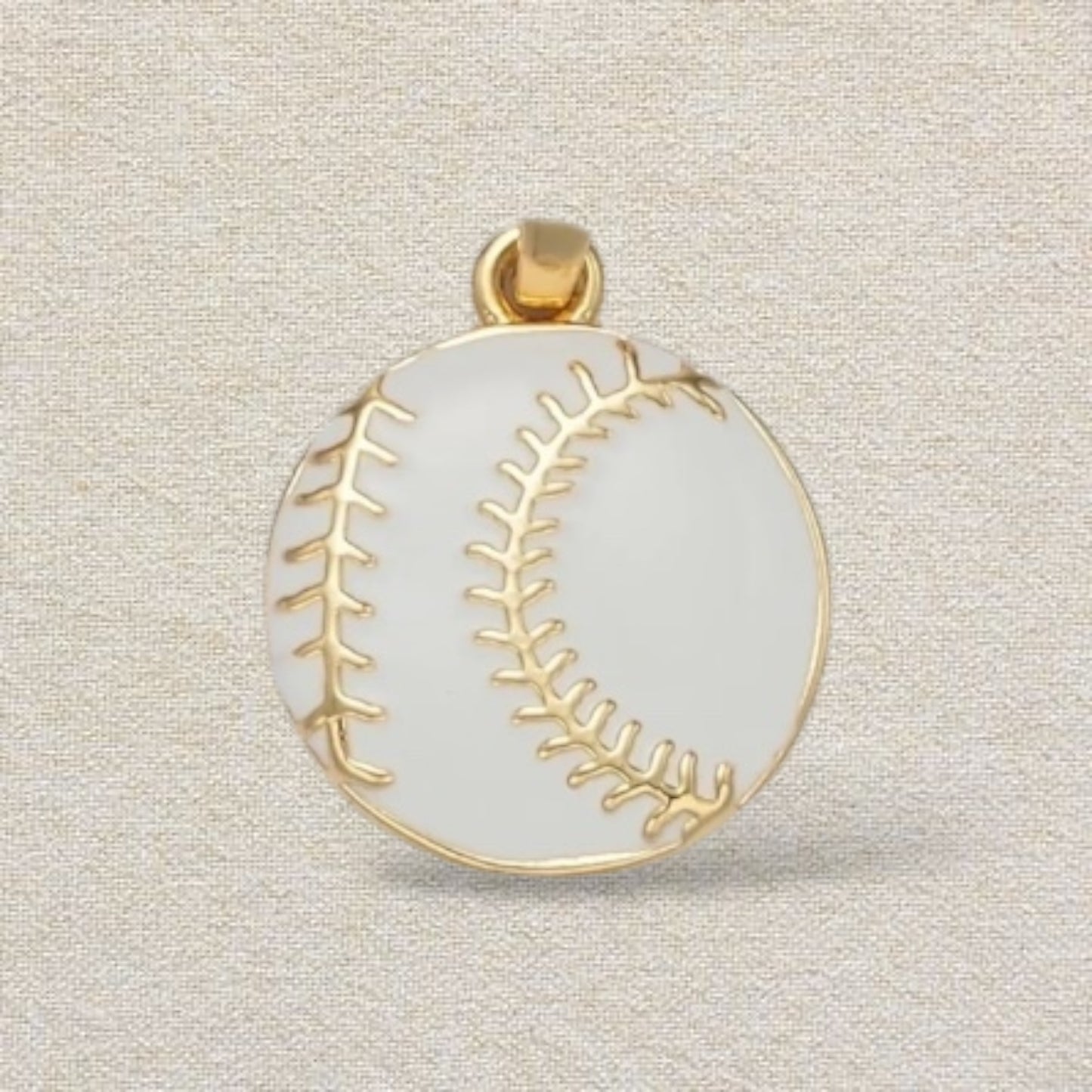 gold and white baseball charm
