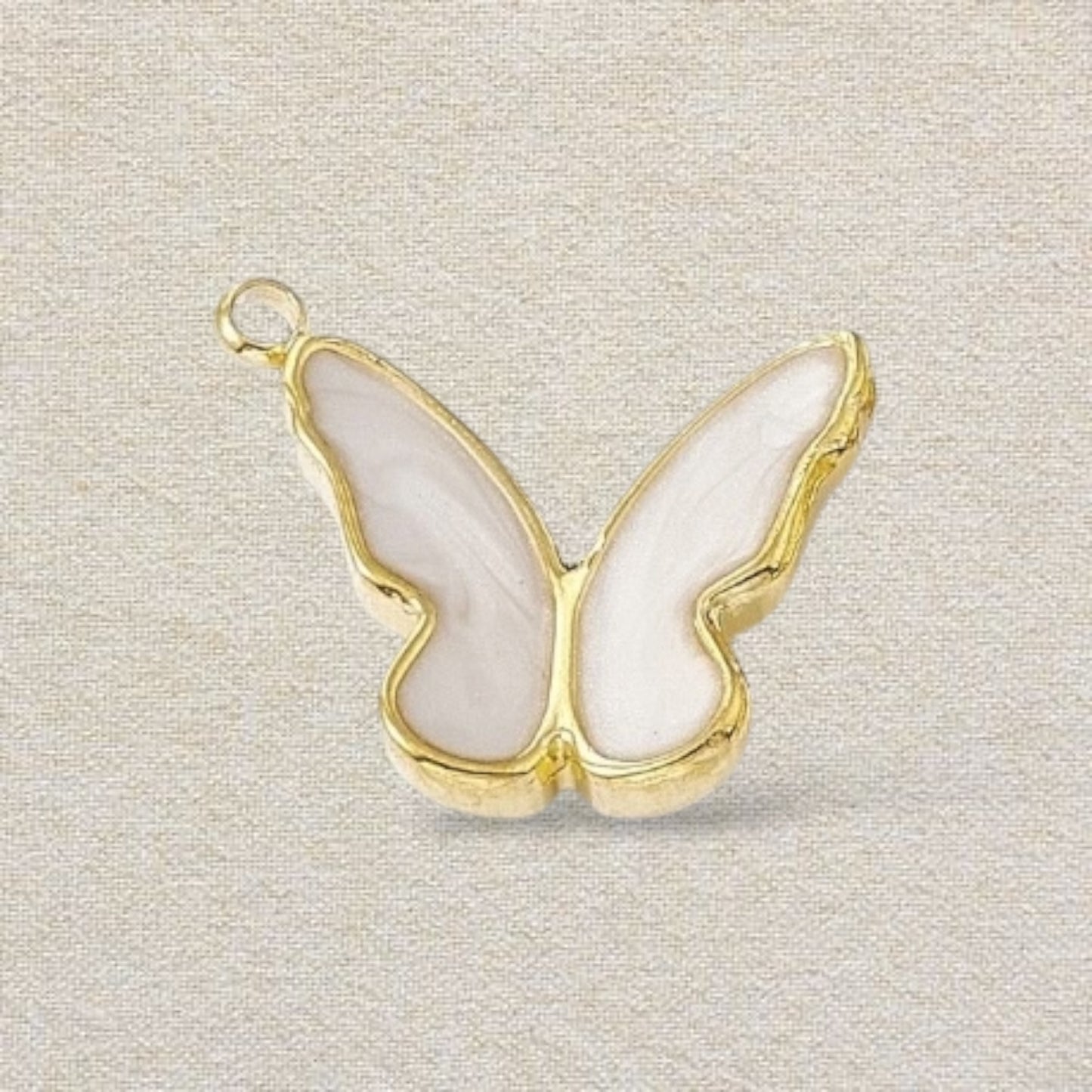 gold and white butterfly charm