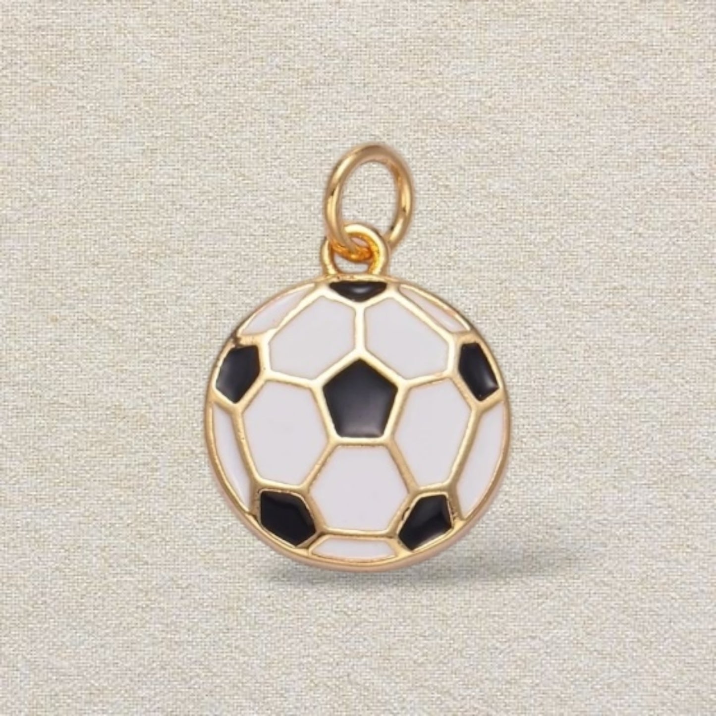 gold and white soccer charm