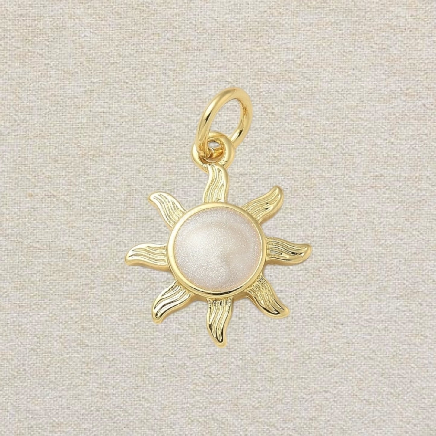 gold and pink sun charm