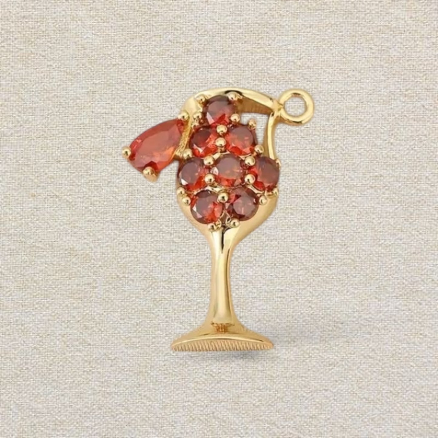 gold and red cocktail charm