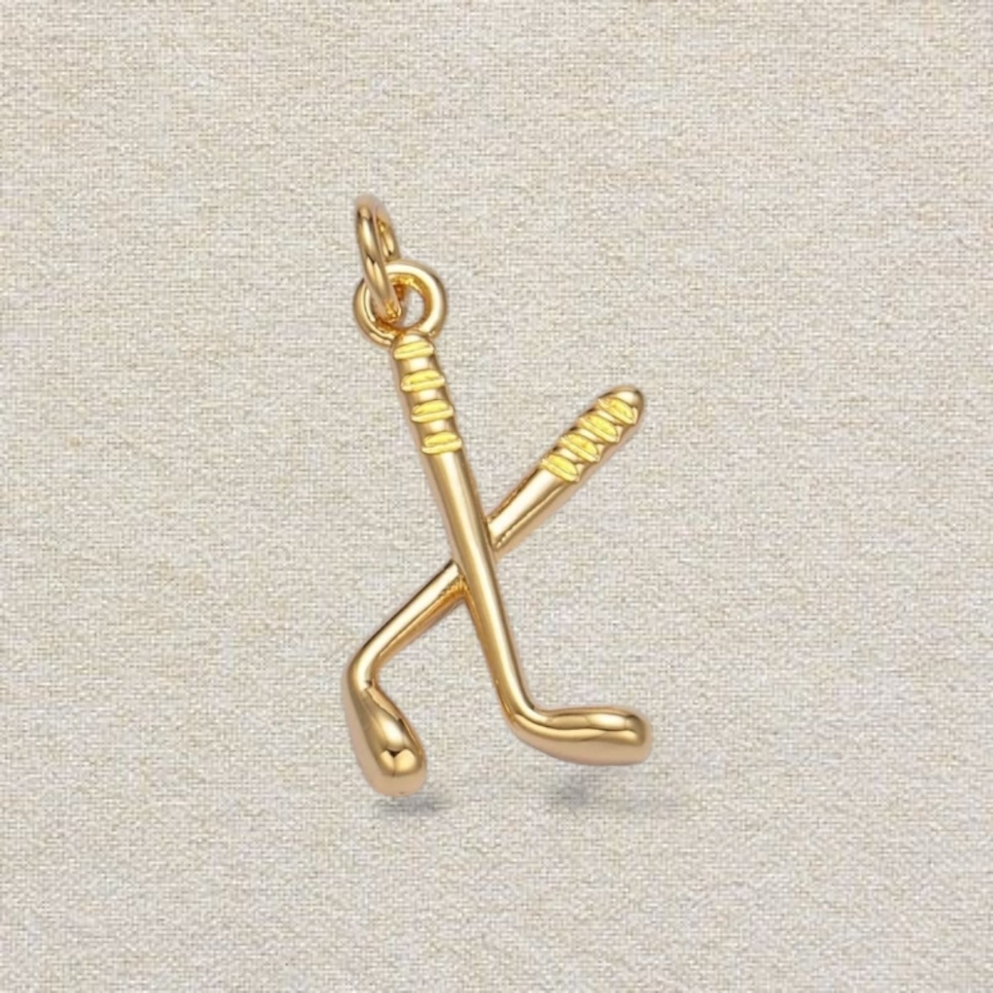 gold hockey stick charm