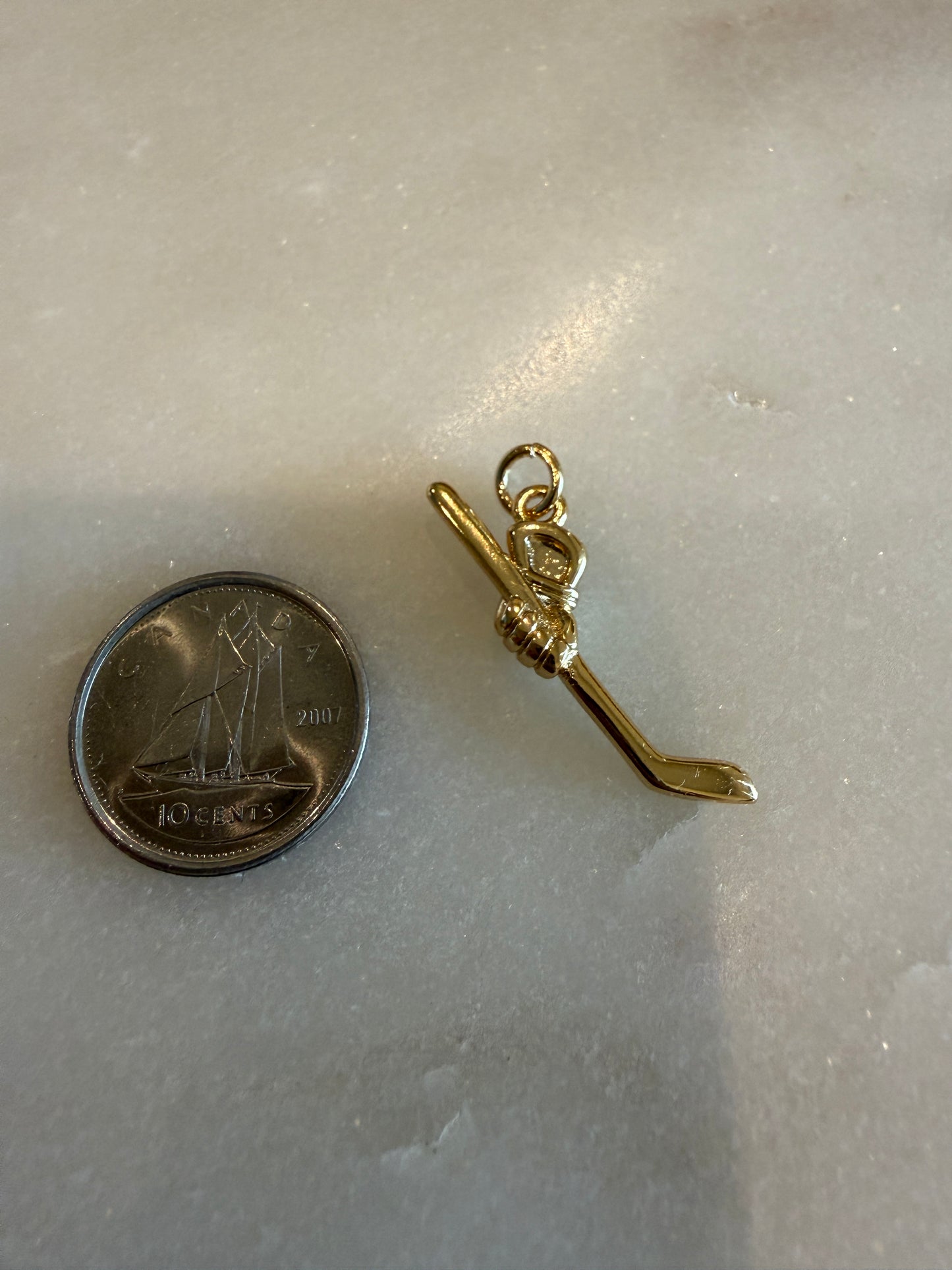 hockey stick and glove charm