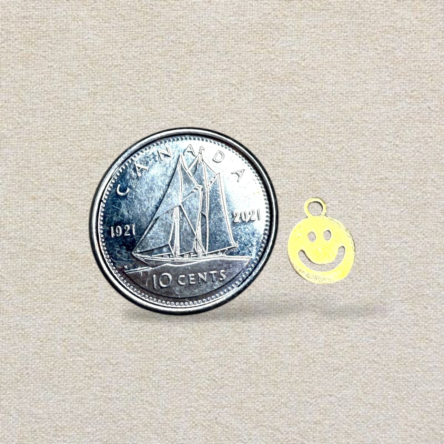 gold smiley face charm