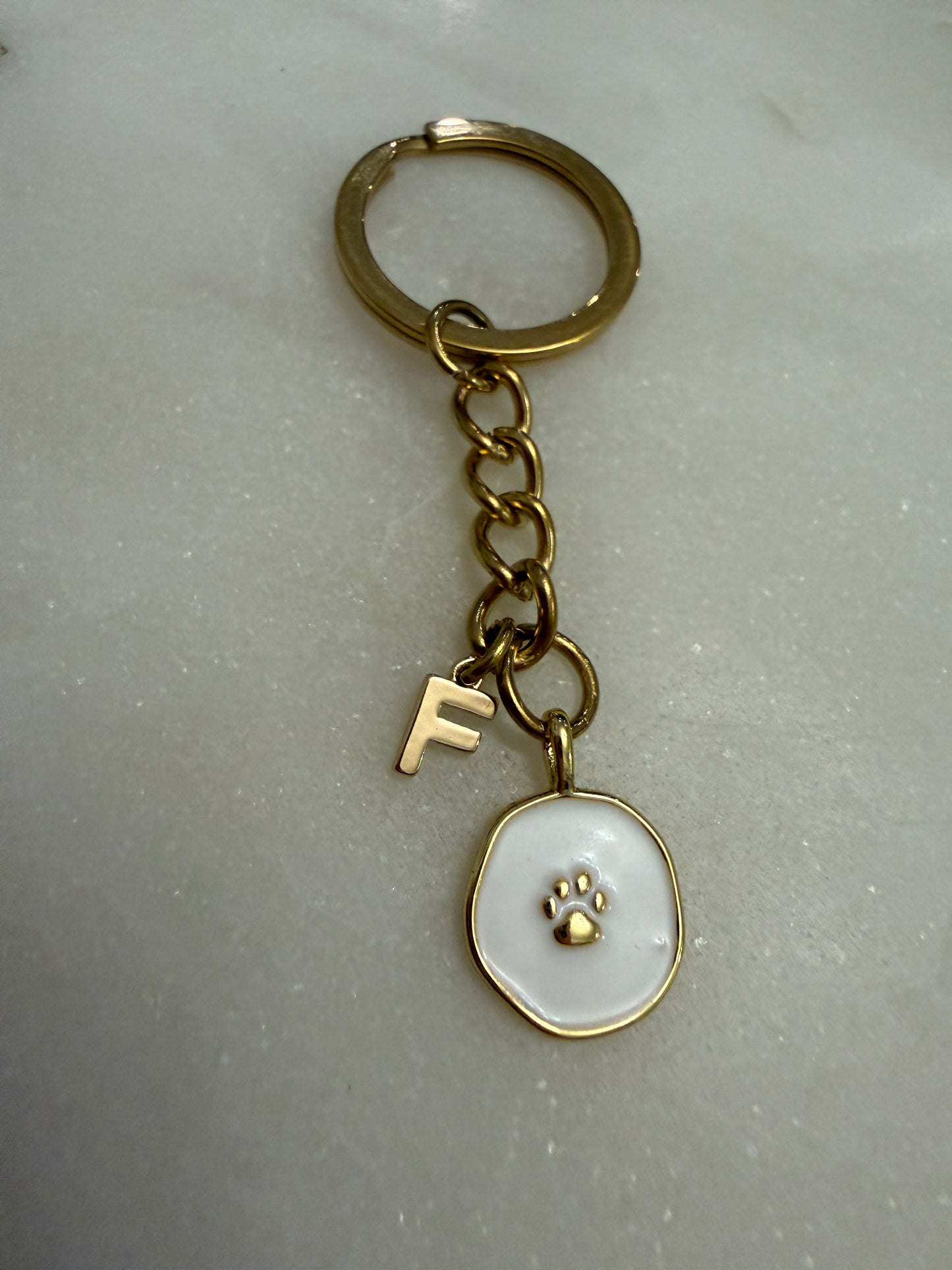 IBC X PAWS white pendant keychain