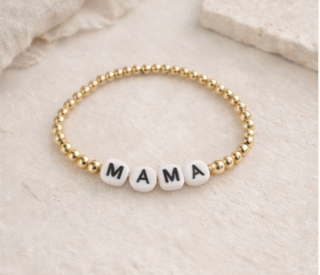 the mama bracelet in gold (white & black)
