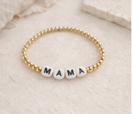 the mama bracelet in gold (white & black)