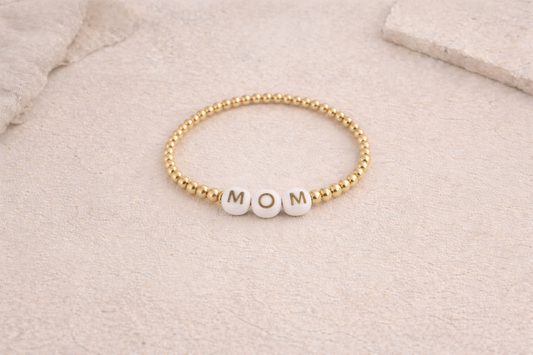 the mom bracelet in gold