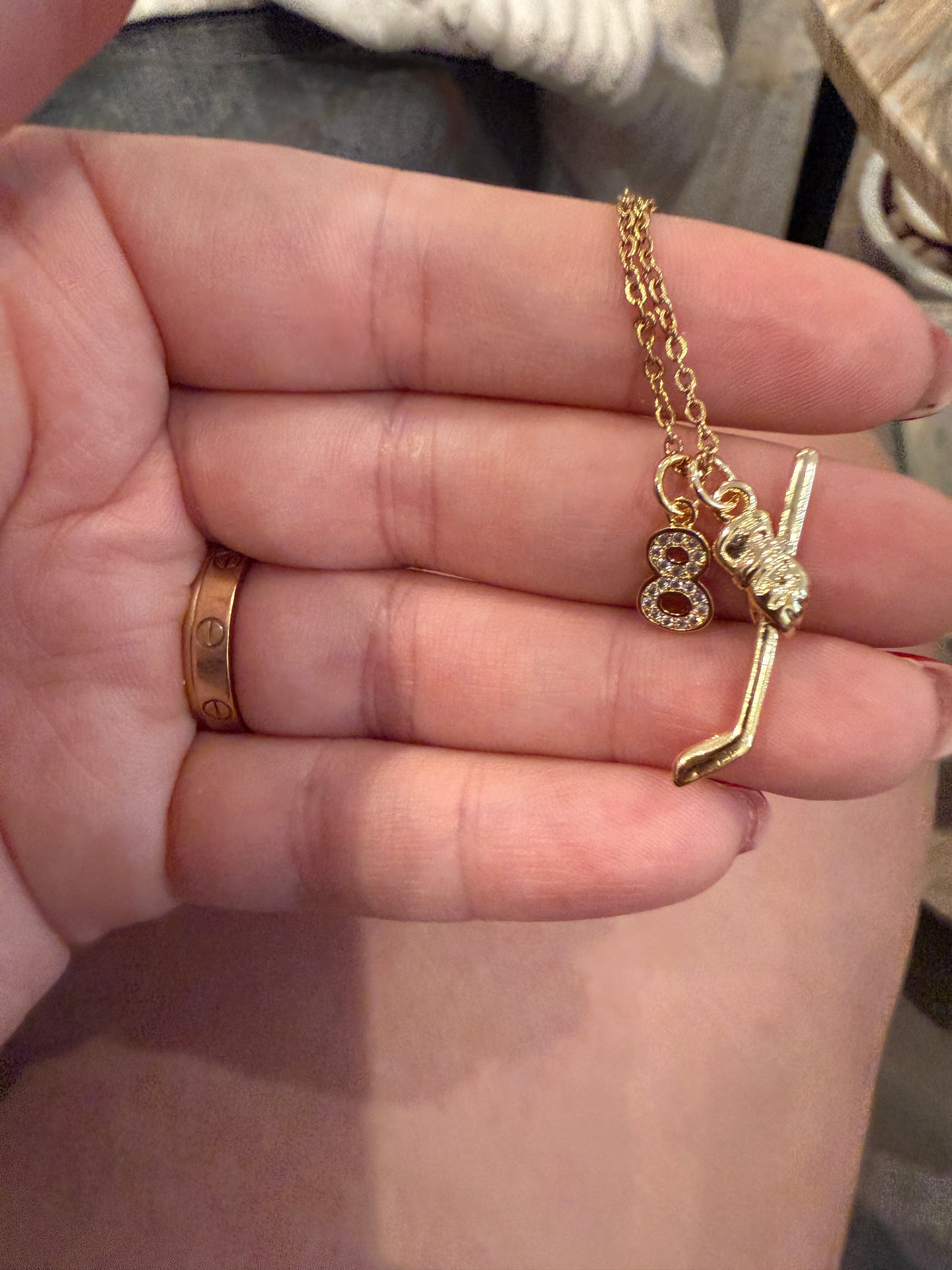 Gold hockey necklace