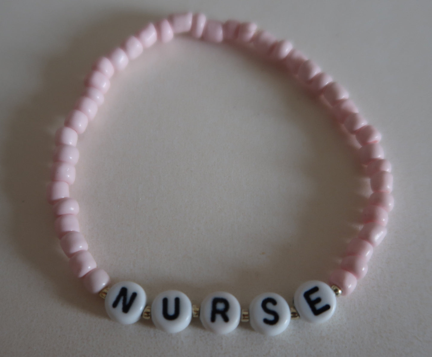 the nurse beaded bracelet in pink