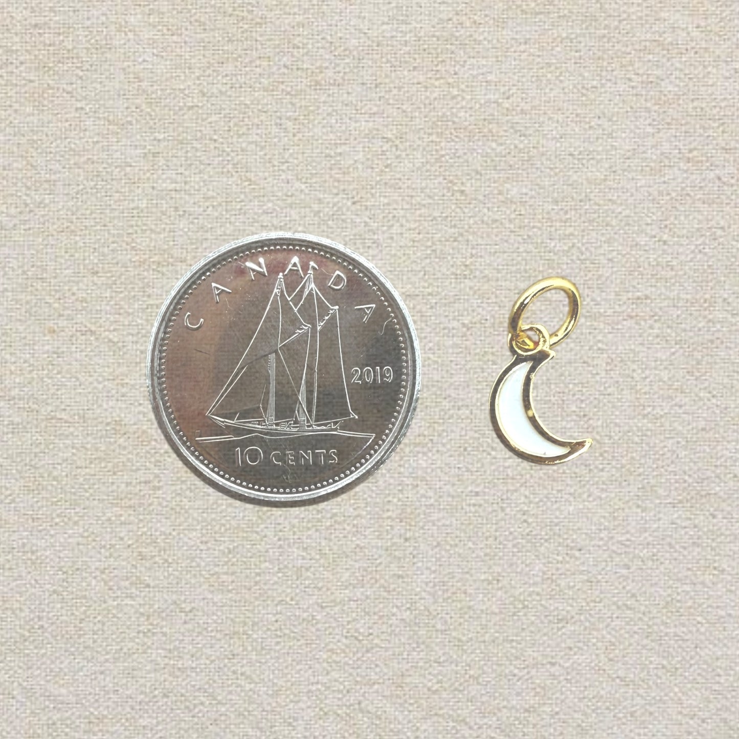 gold and white mini moon charm