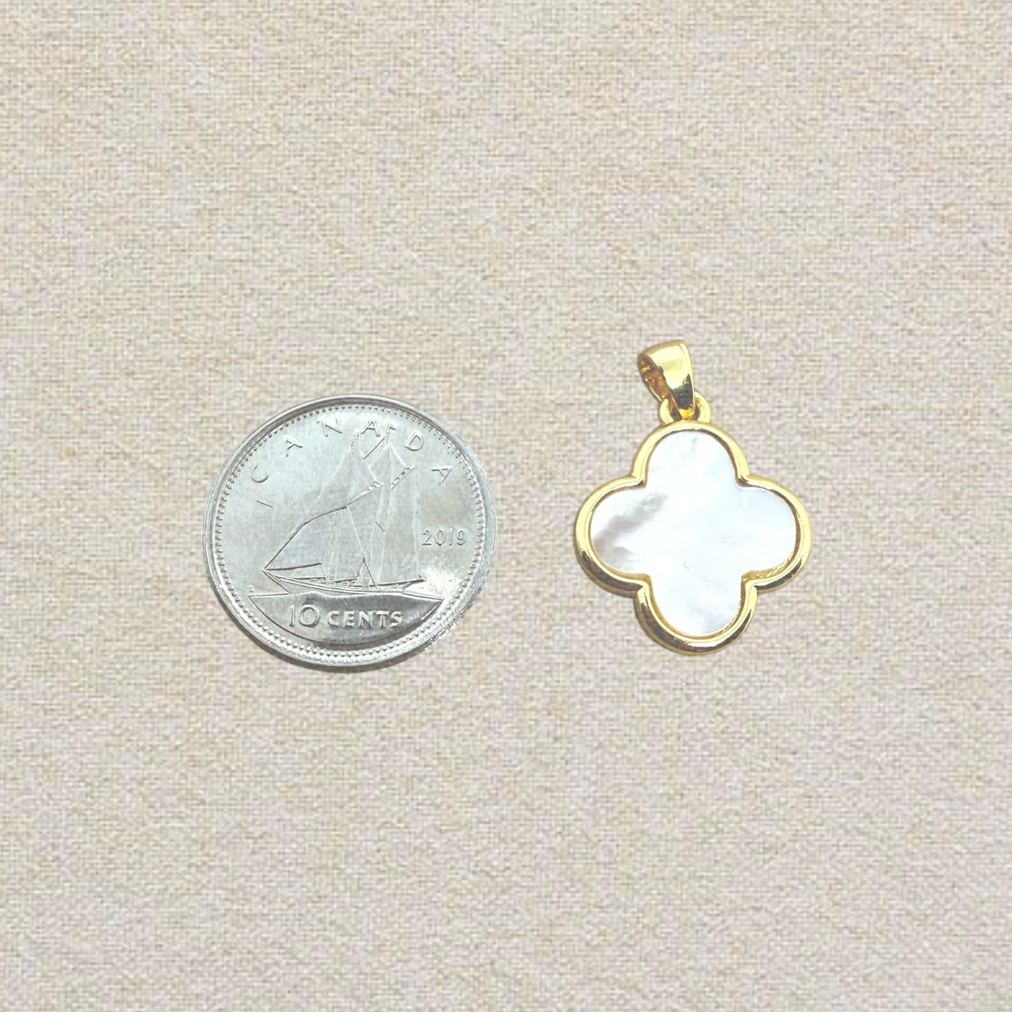 gold and white clover charm