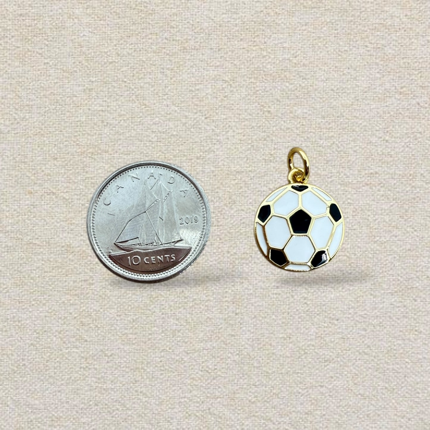 gold and white soccer charm