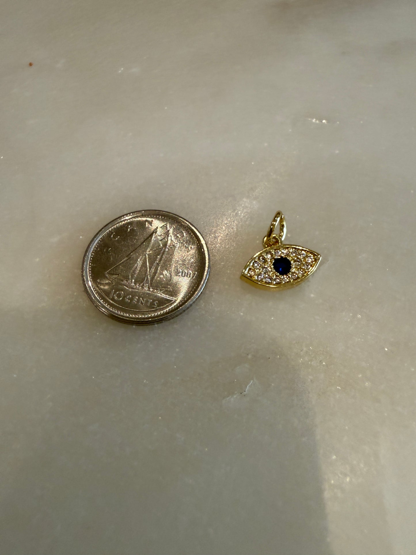 gold and blue evil eye rhinestone charm