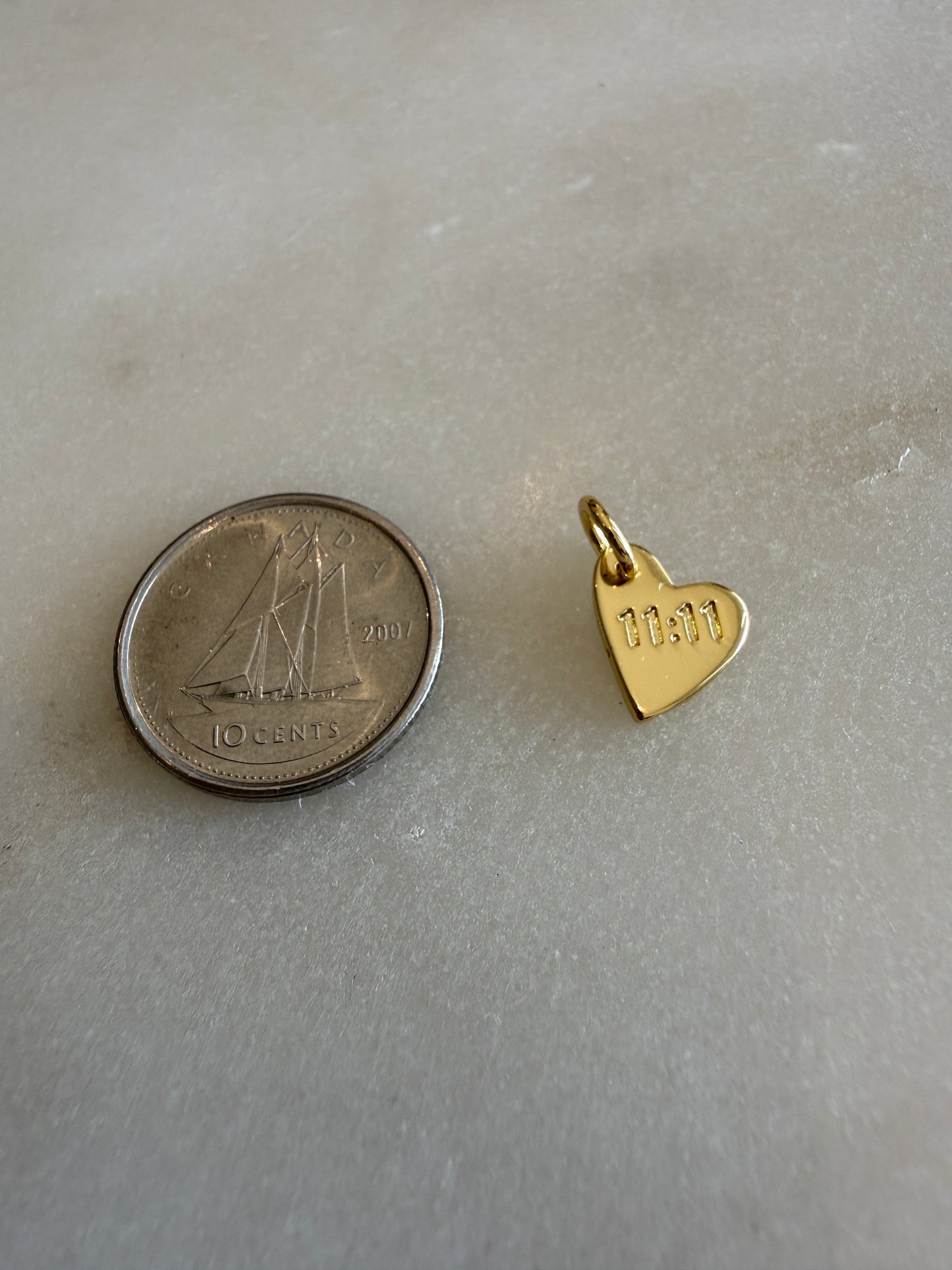 heart charm (11:11)